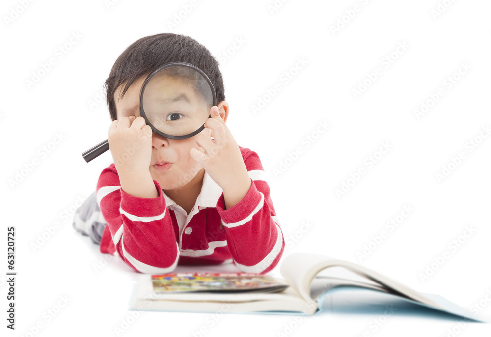 surprised kid looking through from magnifying glass