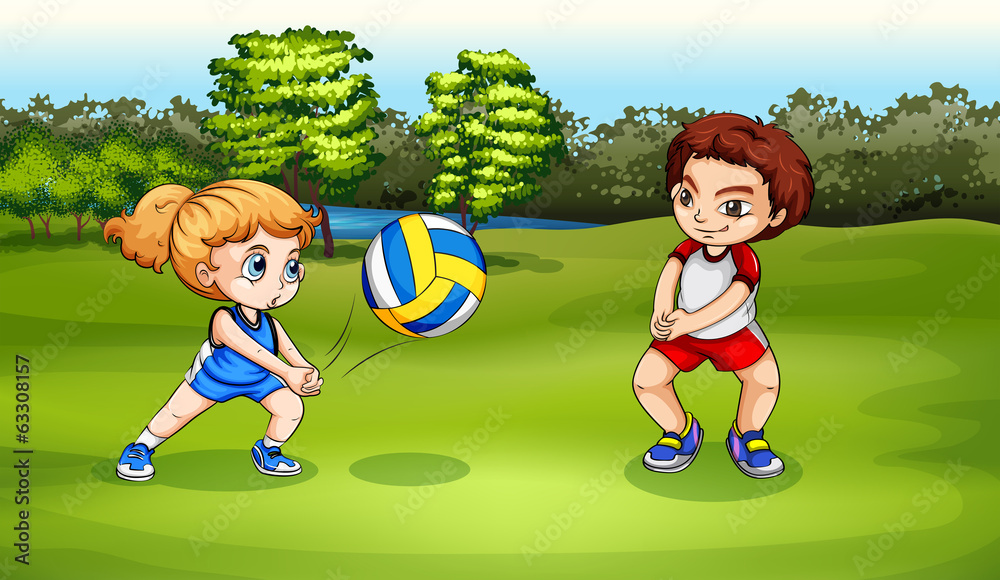 A girl and a boy playing volleyball