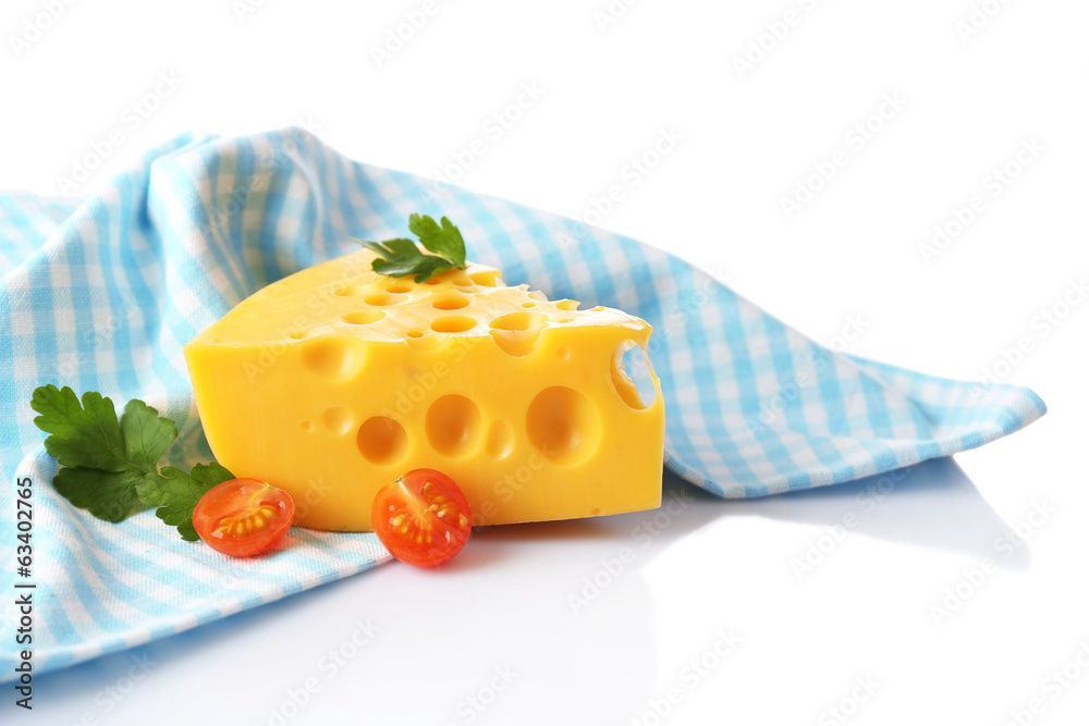 Piece of cheese and tomatoes,on color napkin, isolated on white