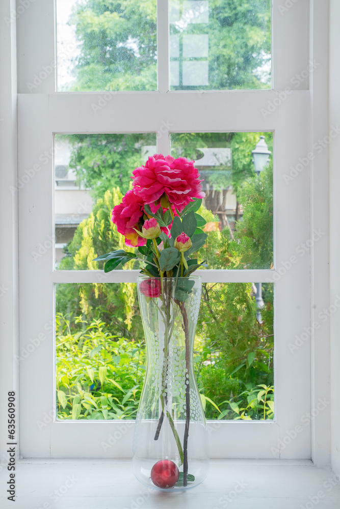 Vase with a flower on the windowsill country house