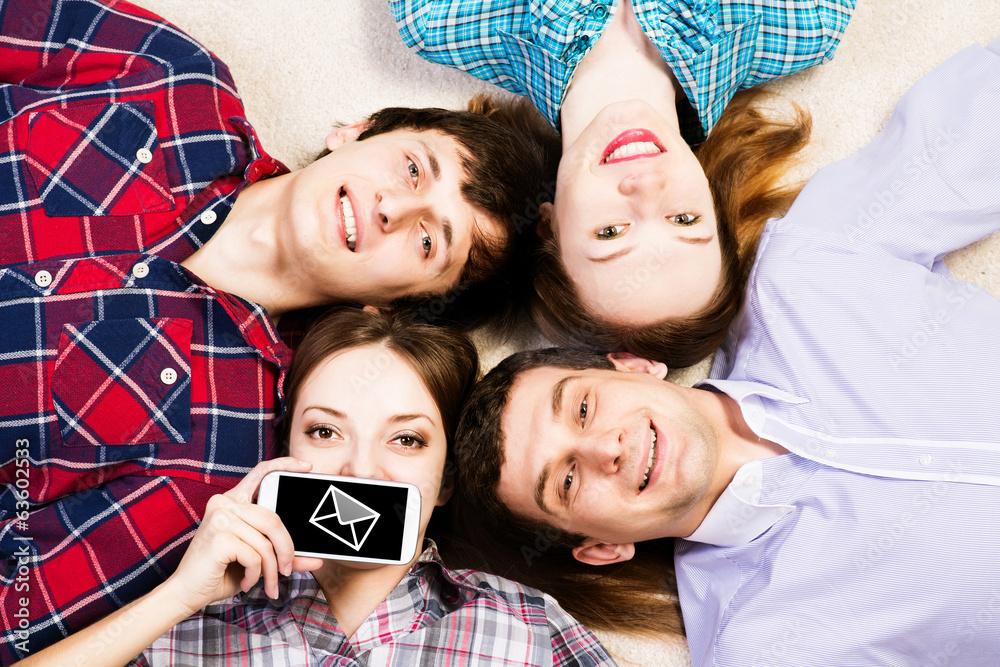 four young men lie together