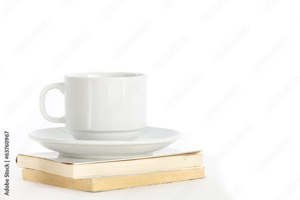 Composition with books and cup of coffee isolated on white