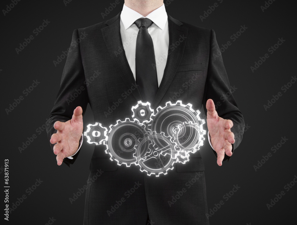 businessman showing gears