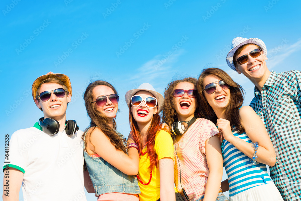 group of young people wearing sunglasses and hat