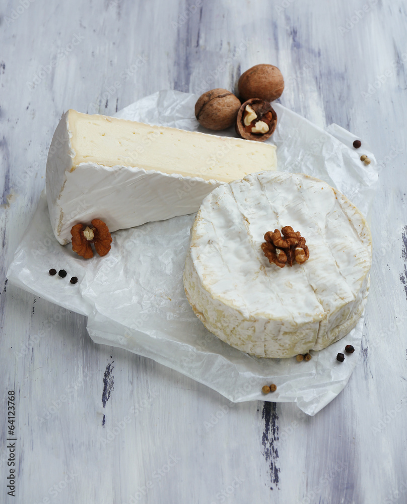 Tasty Italian cheese on wooden table