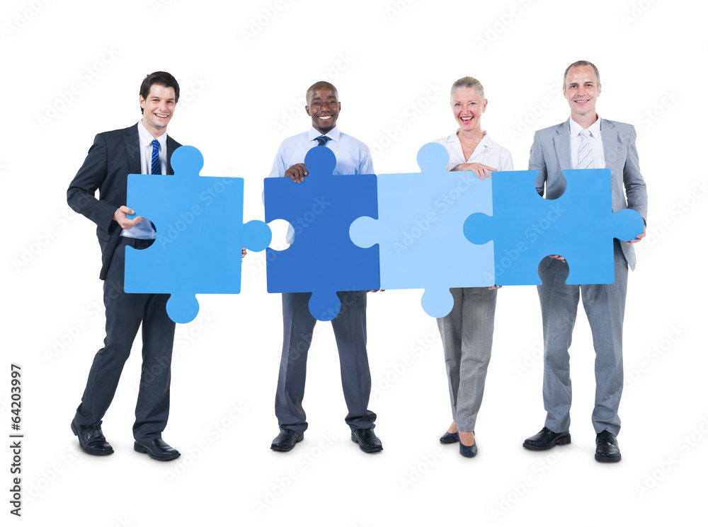 People Holding a Pieces of Jigsaw