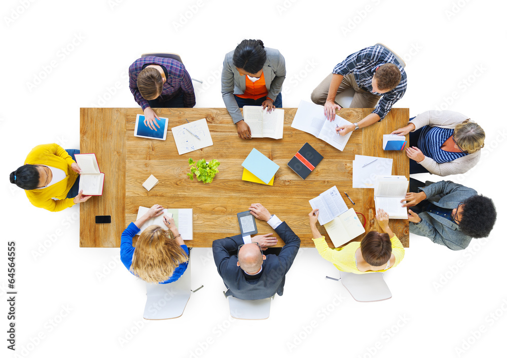 Group of Busienss People Reading Notes on a Meeting Table