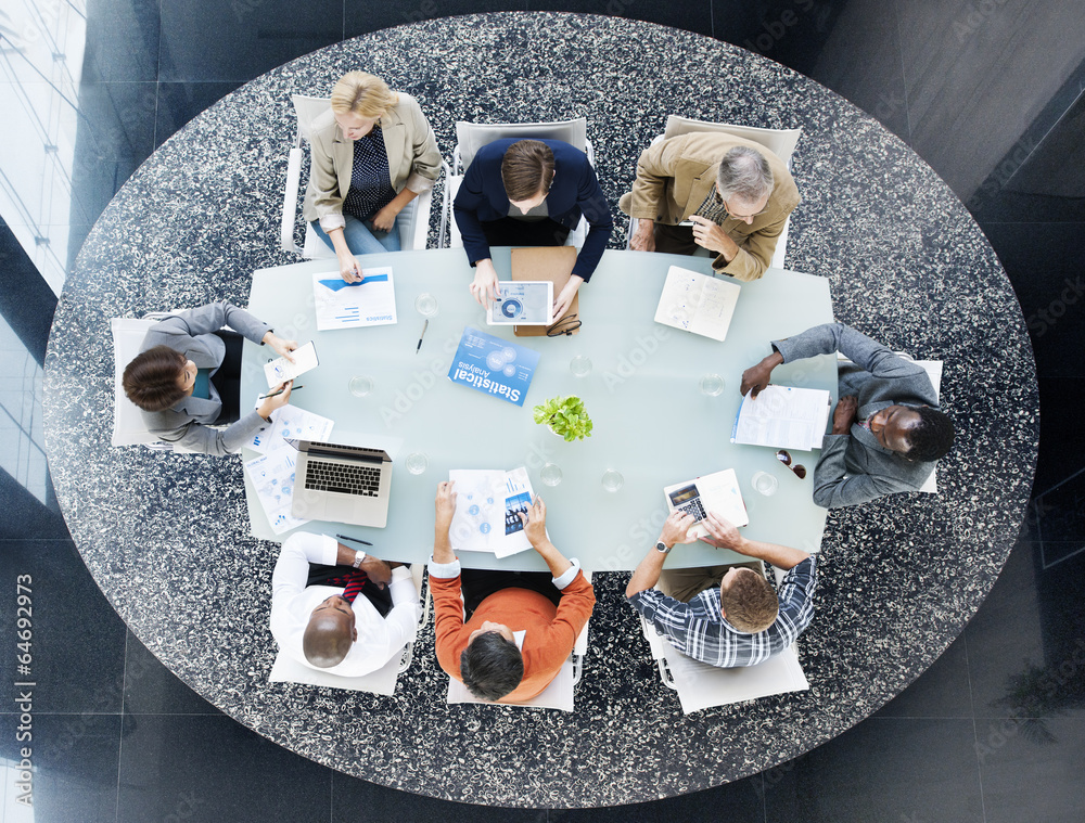 Group of Business People Discussing Statistical Analysis