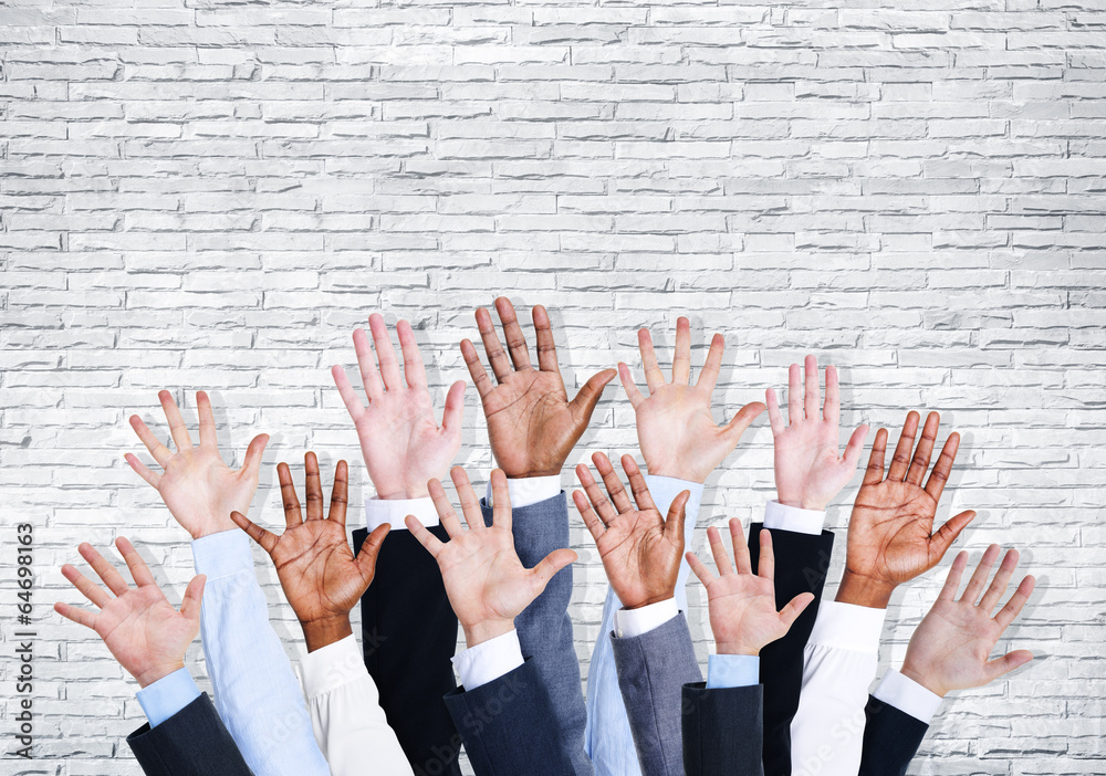 Group of Business Human Arms Raised with Brick Wall