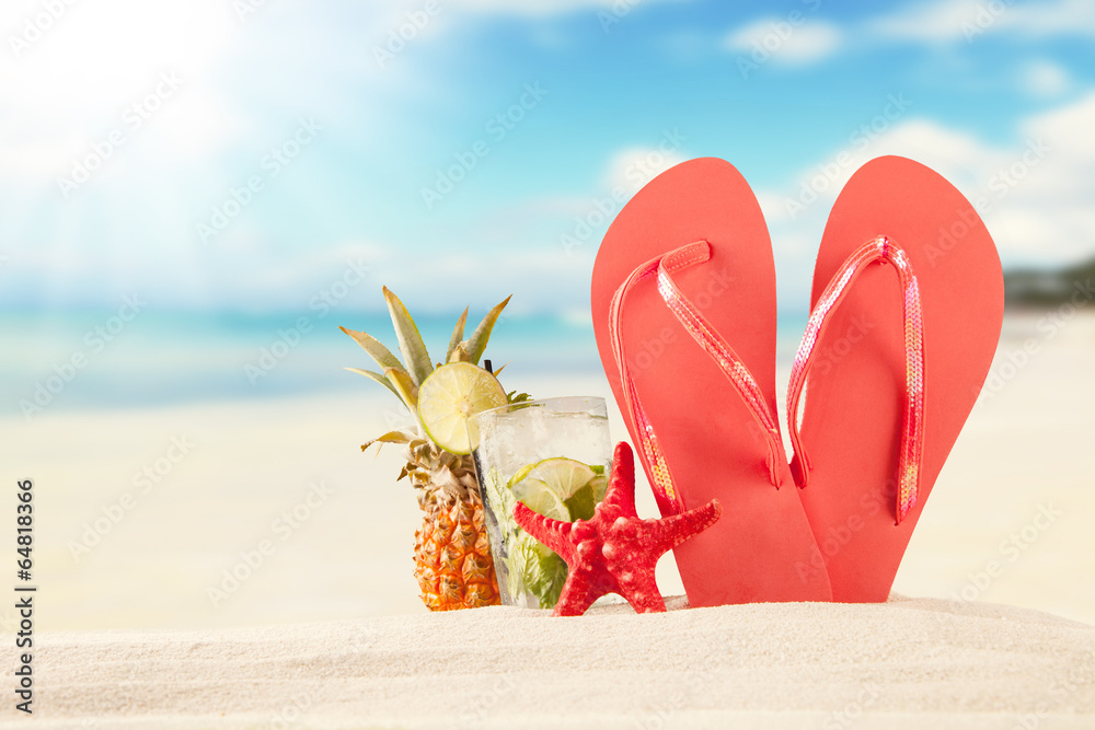 Summer beach with red sandals and shells