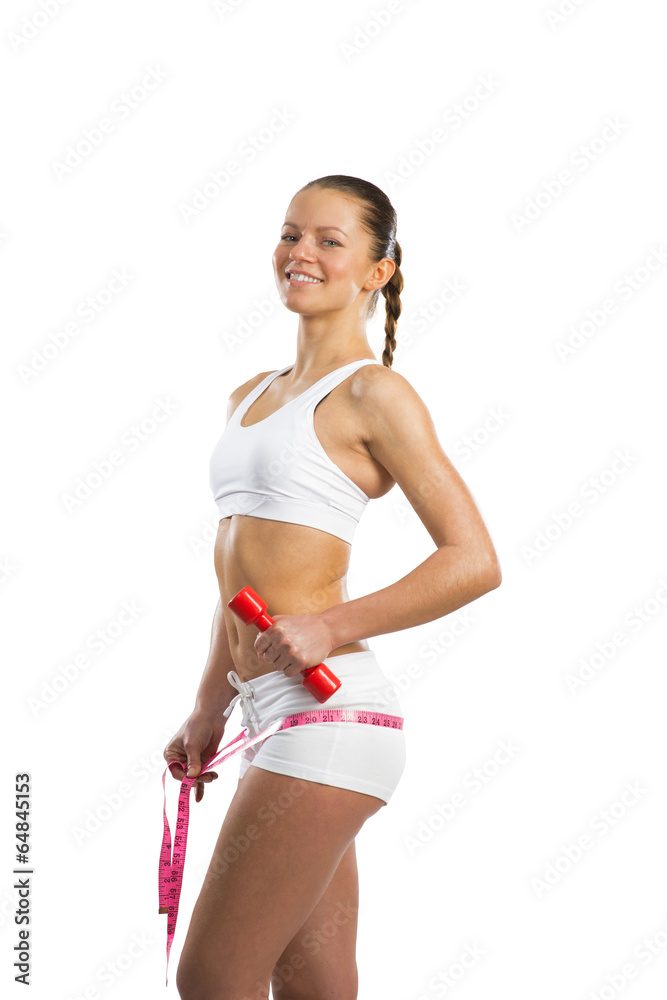 young athletic woman measuring waist