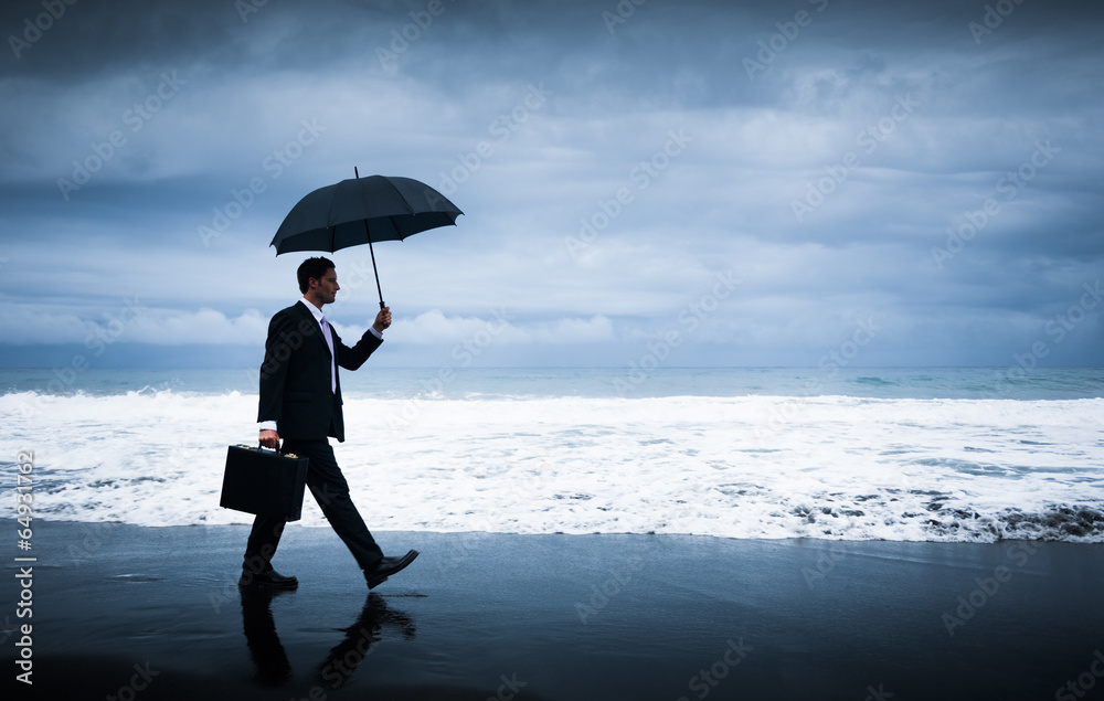 Businessman facing storm