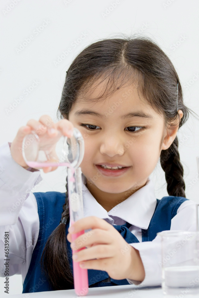 Asian student making science experiments