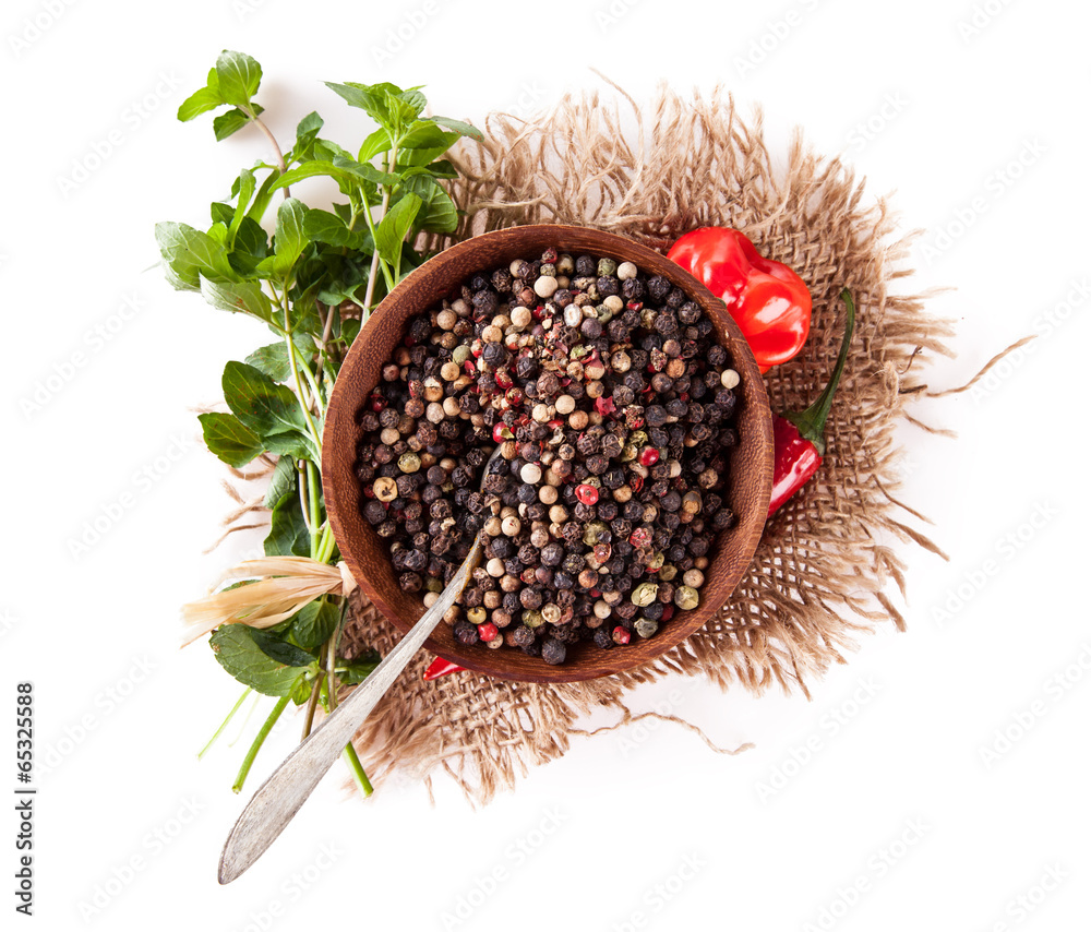 Pepper spice in bowl isolated on white