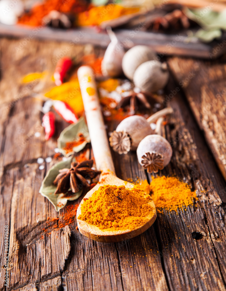 Various spices on wood