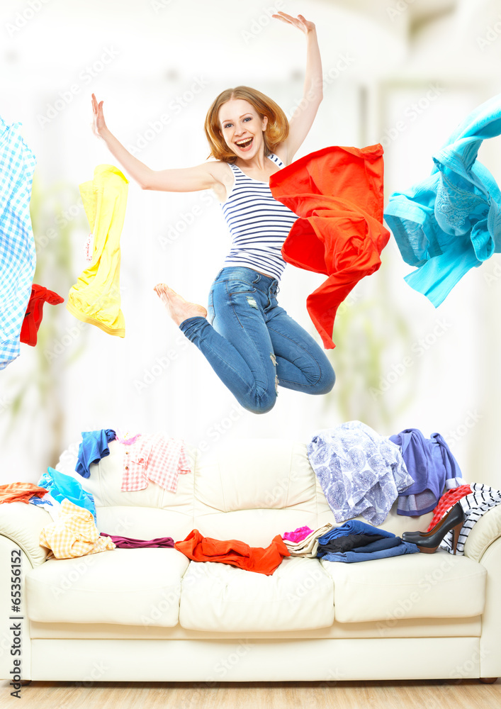 Funny girl with flying clothes jumping at home