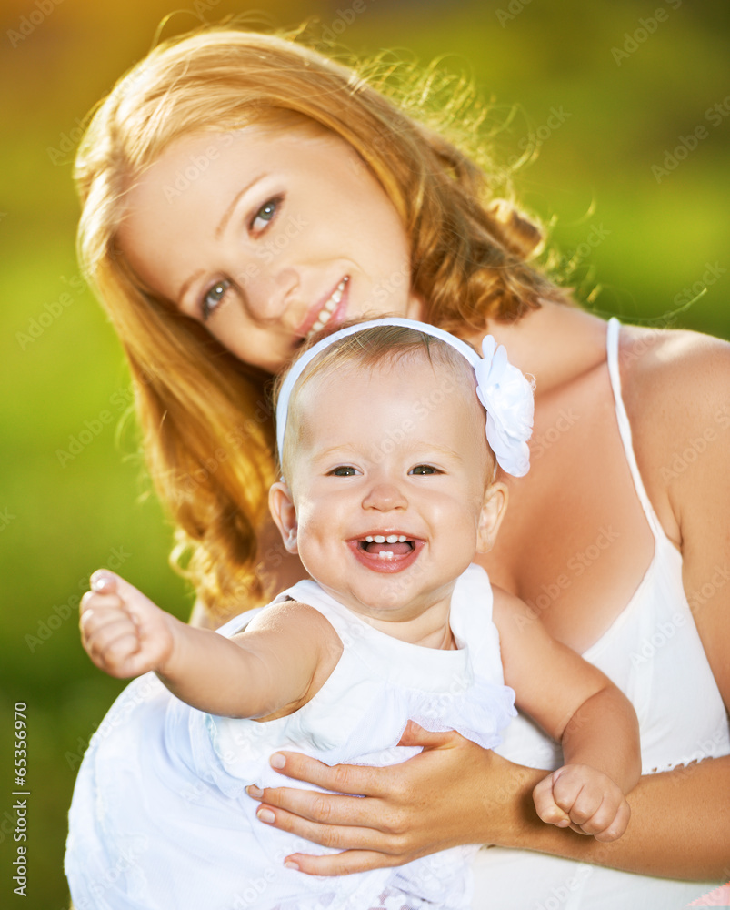 happy family on nature mother and baby daughter