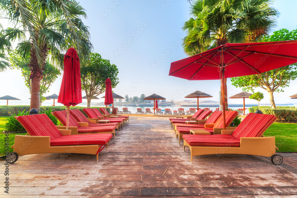 Empty red deckchairs at the sea in Abu Dhabi