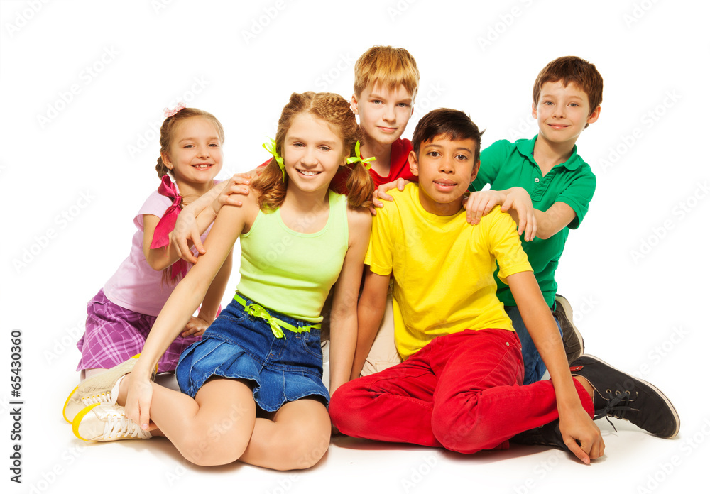 Playing children sitting on the floor together