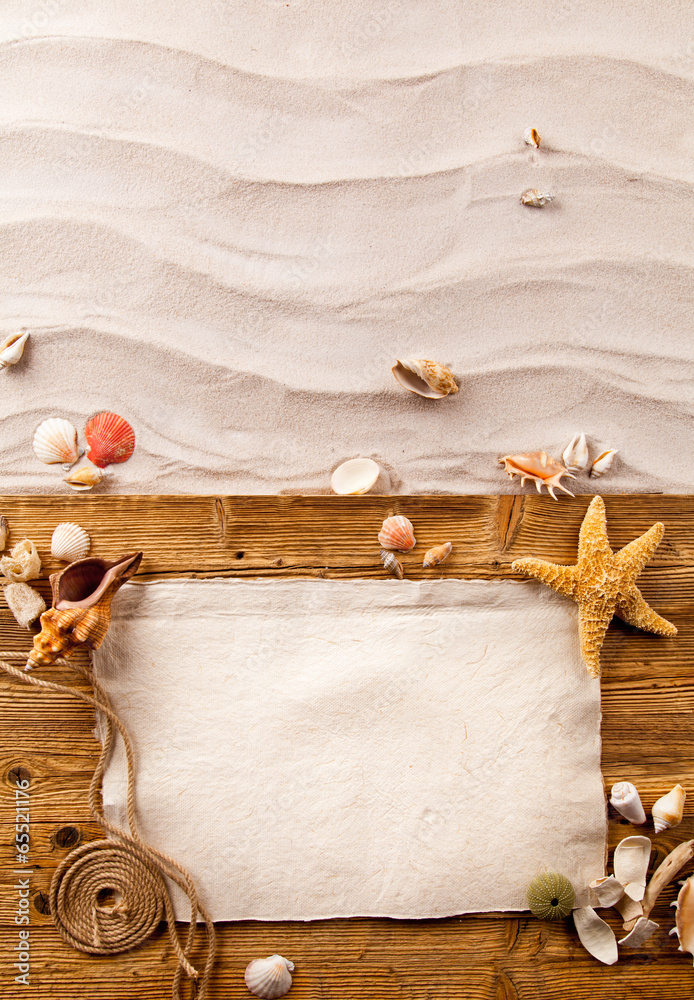 Sandy beach with wooden planks and blank paper