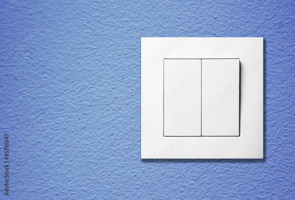 Light switch on a wall