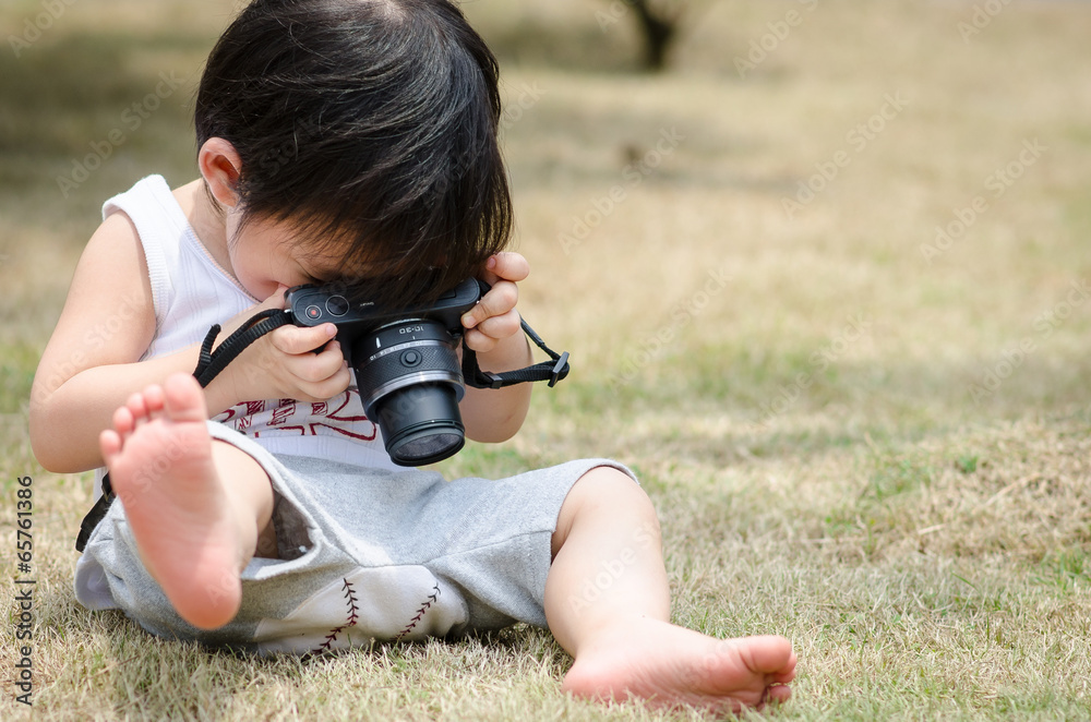 Baby boy with camera