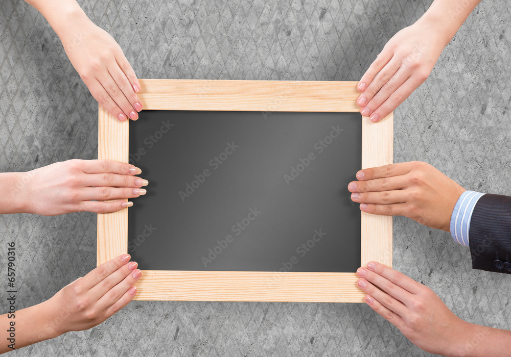 Hands holding frame