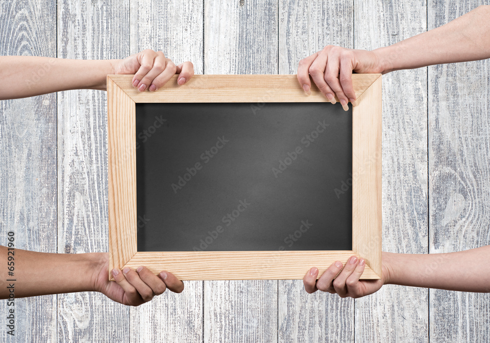 Hands holding frame