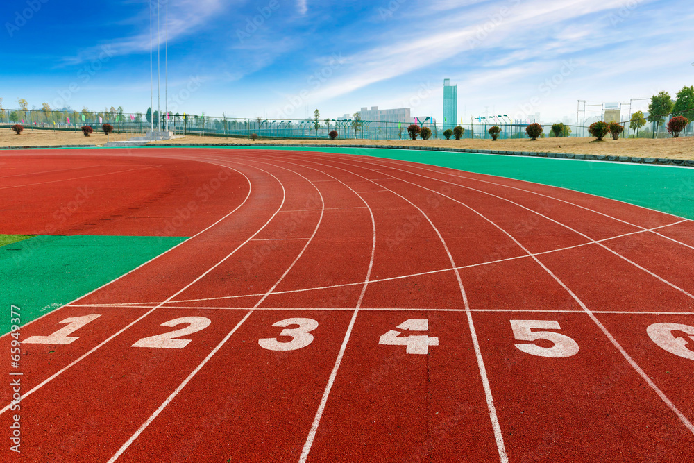 red plastic runway and numbers in a sports ground