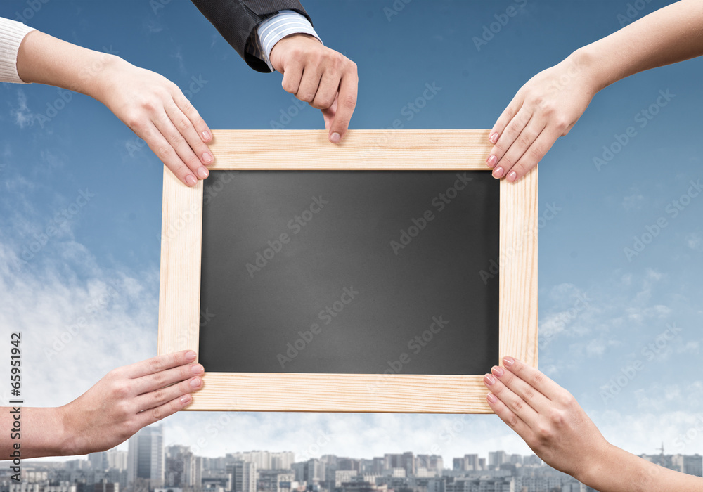 Hands holding frame