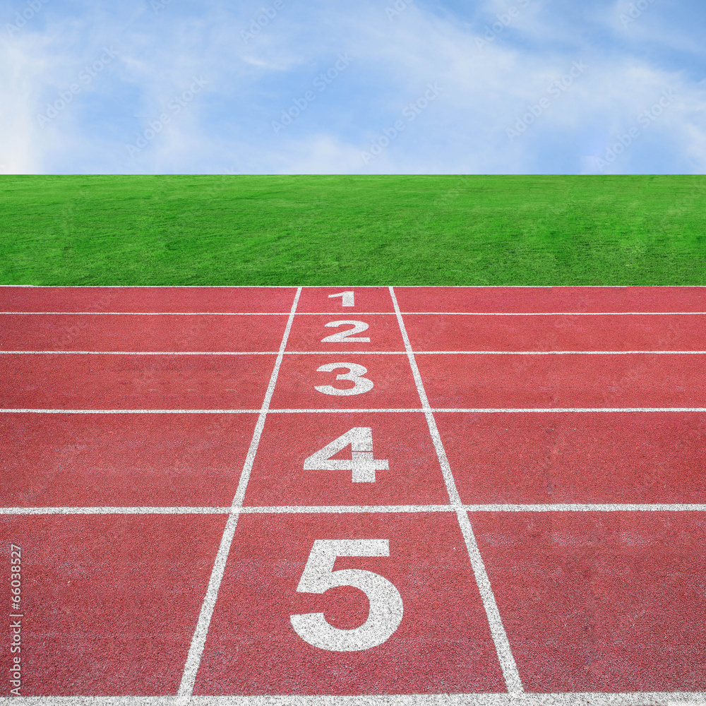 Start or finish position on running track with blue sky