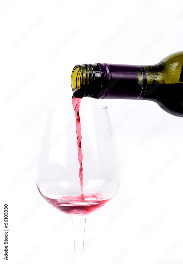 Red wine pouring into a glass