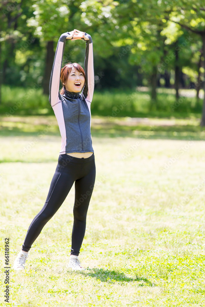 young asian woman exercising in the park