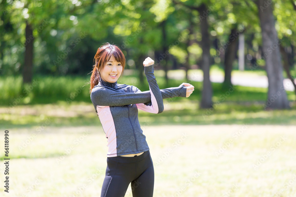 young asian woman exercising in the park