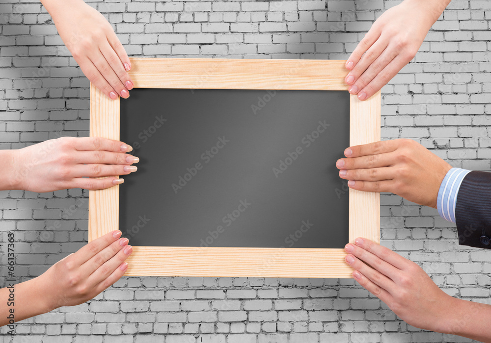 Hands holding frame