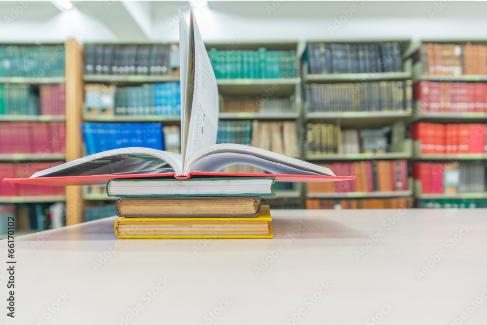 A pile of books with library on the back