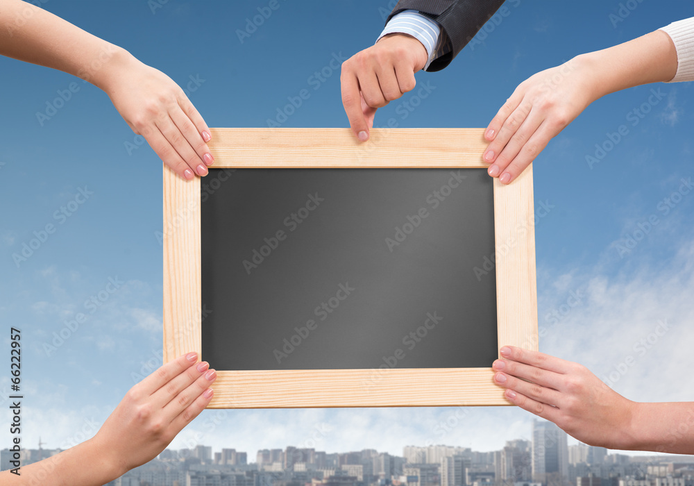 Hands holding frame