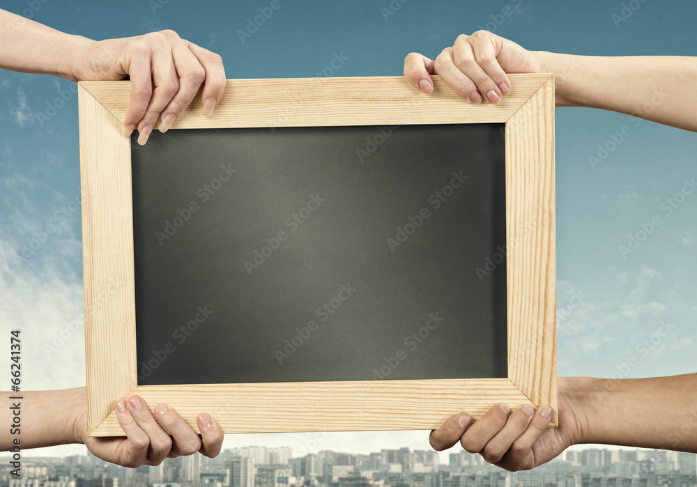 Hands holding frame