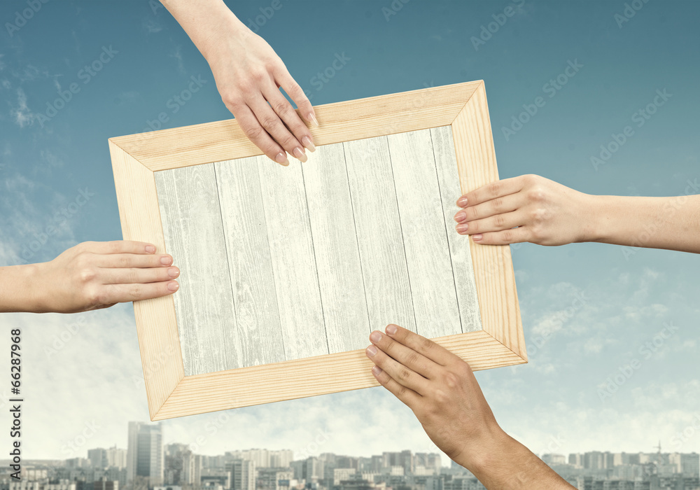 Hands holding frame