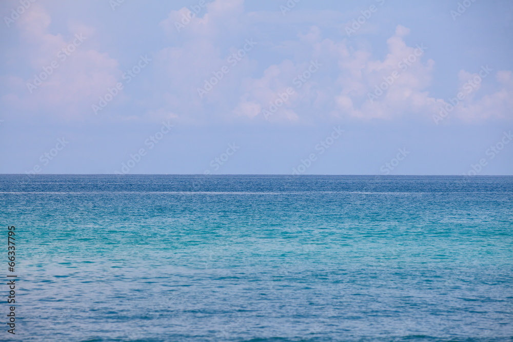 Blue sea water and blue sky background