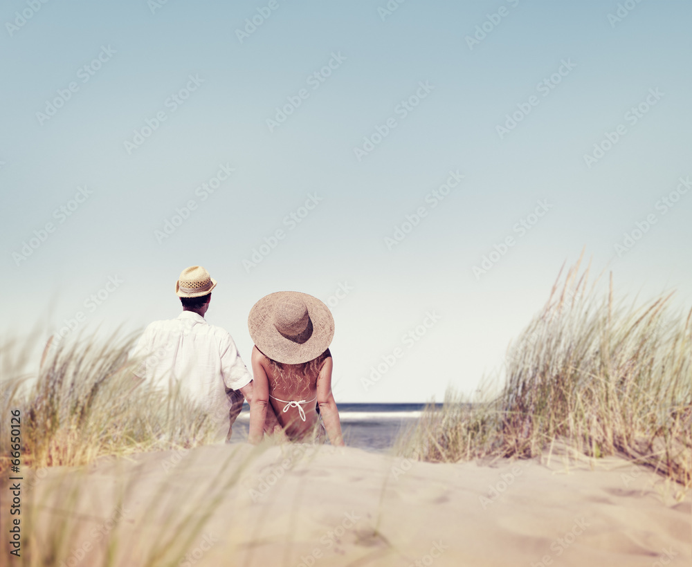 Couple Sitting and Looking at the View of the Beach