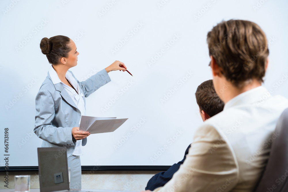 Business woman showing a presentation