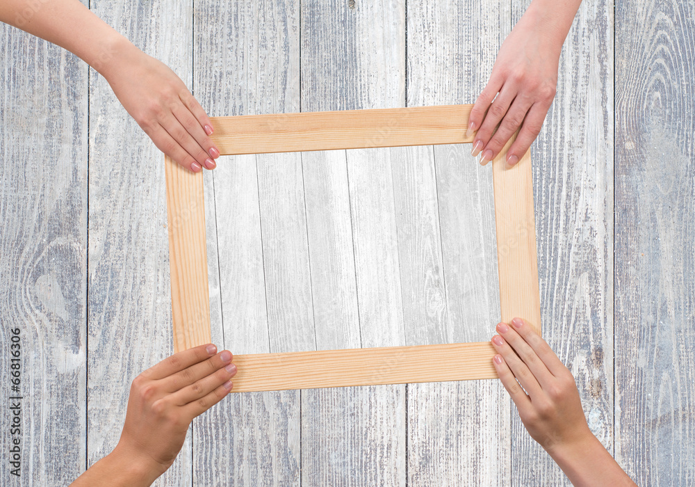 Hands holding frame