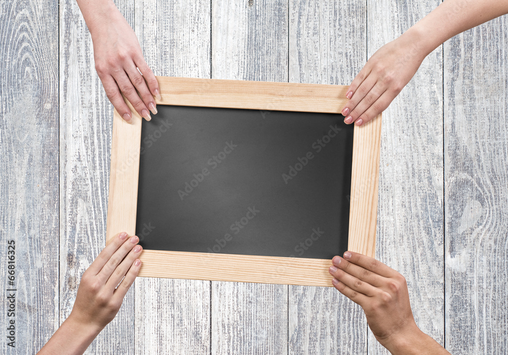 Hands holding frame