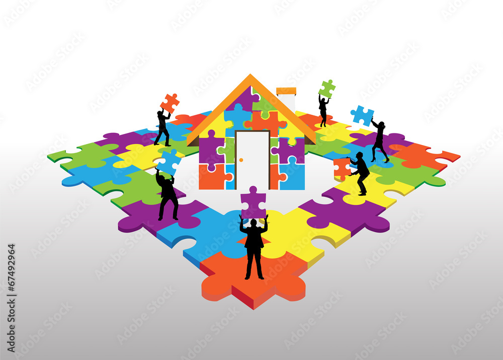 Business people standing on jigsaw puzzle building house