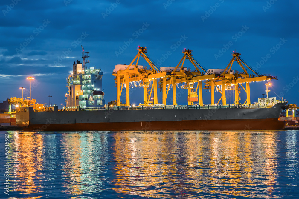 Container Cargo freight ship with working Container crane in shi