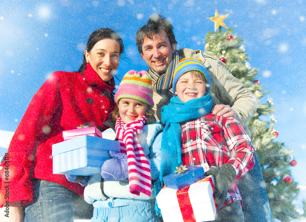 Family Posing For Christmas Themed Picture