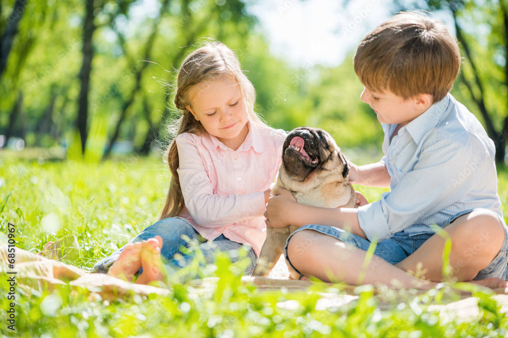 Children in park with pet