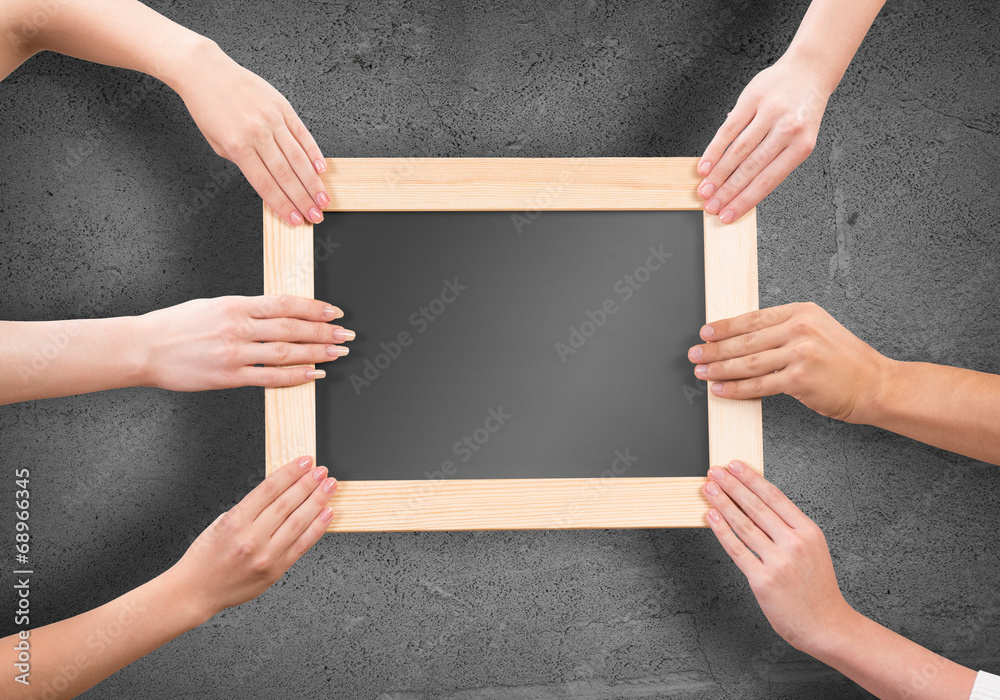 Hands holding frame