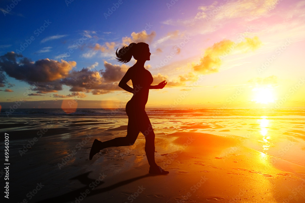 Running girl at sunset silhouette